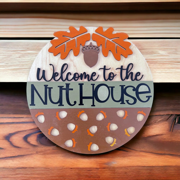 Welcome to the Nut House Wood Door Hanger - Rustic Halo